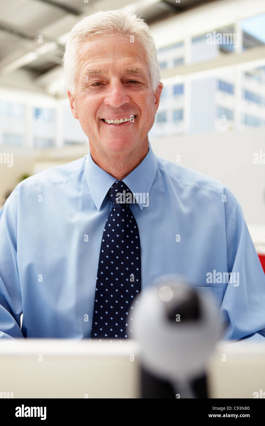 Senior businessman , skype Stock Photo