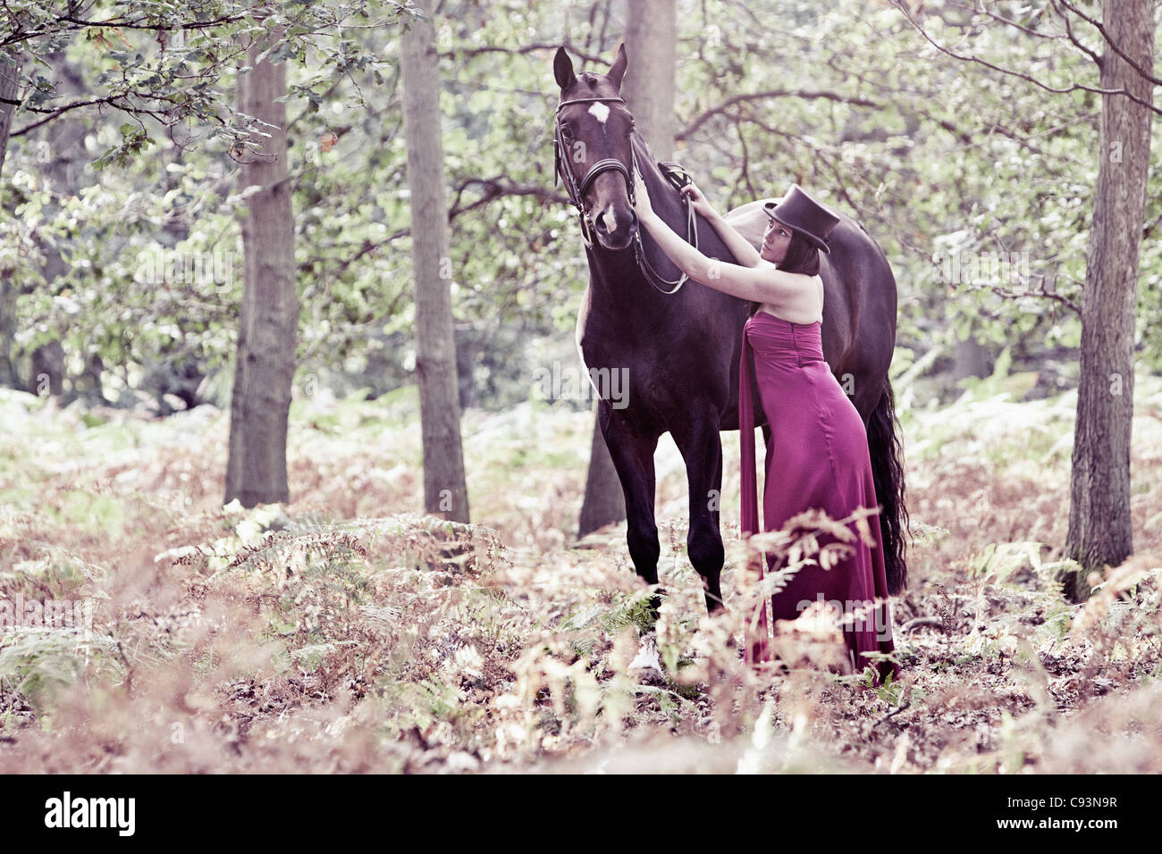 Woman with Horse in Forest Stock Photo