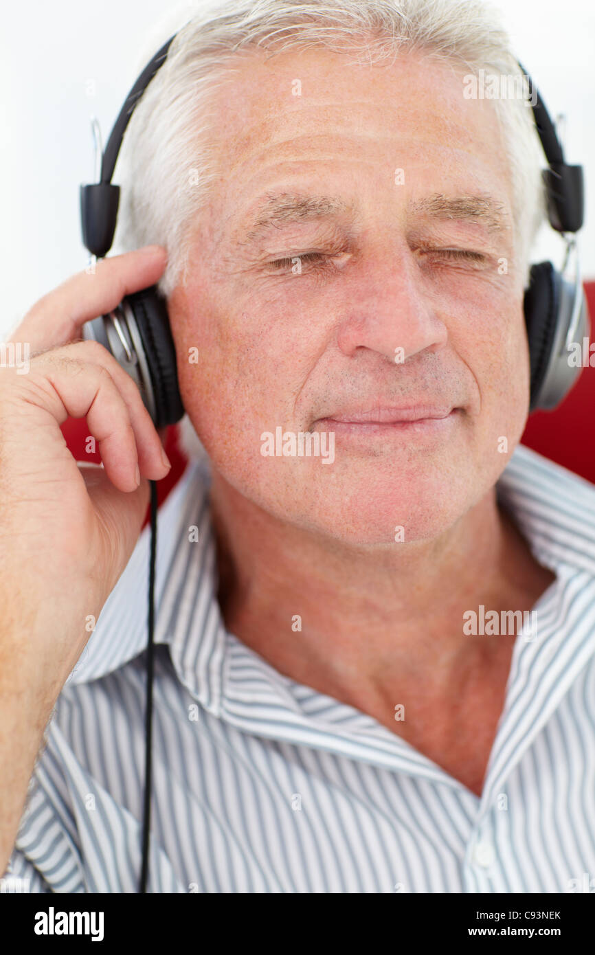 Handsome senior man headphones hi-res stock photography and images - Alamy