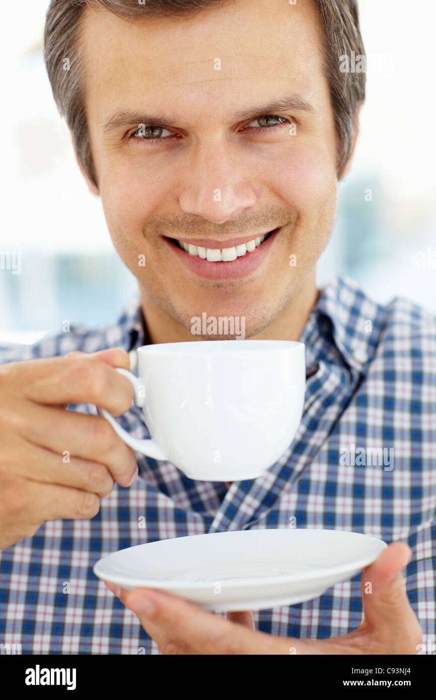 Man relaxing with cup of tea Stock Photo Alamy