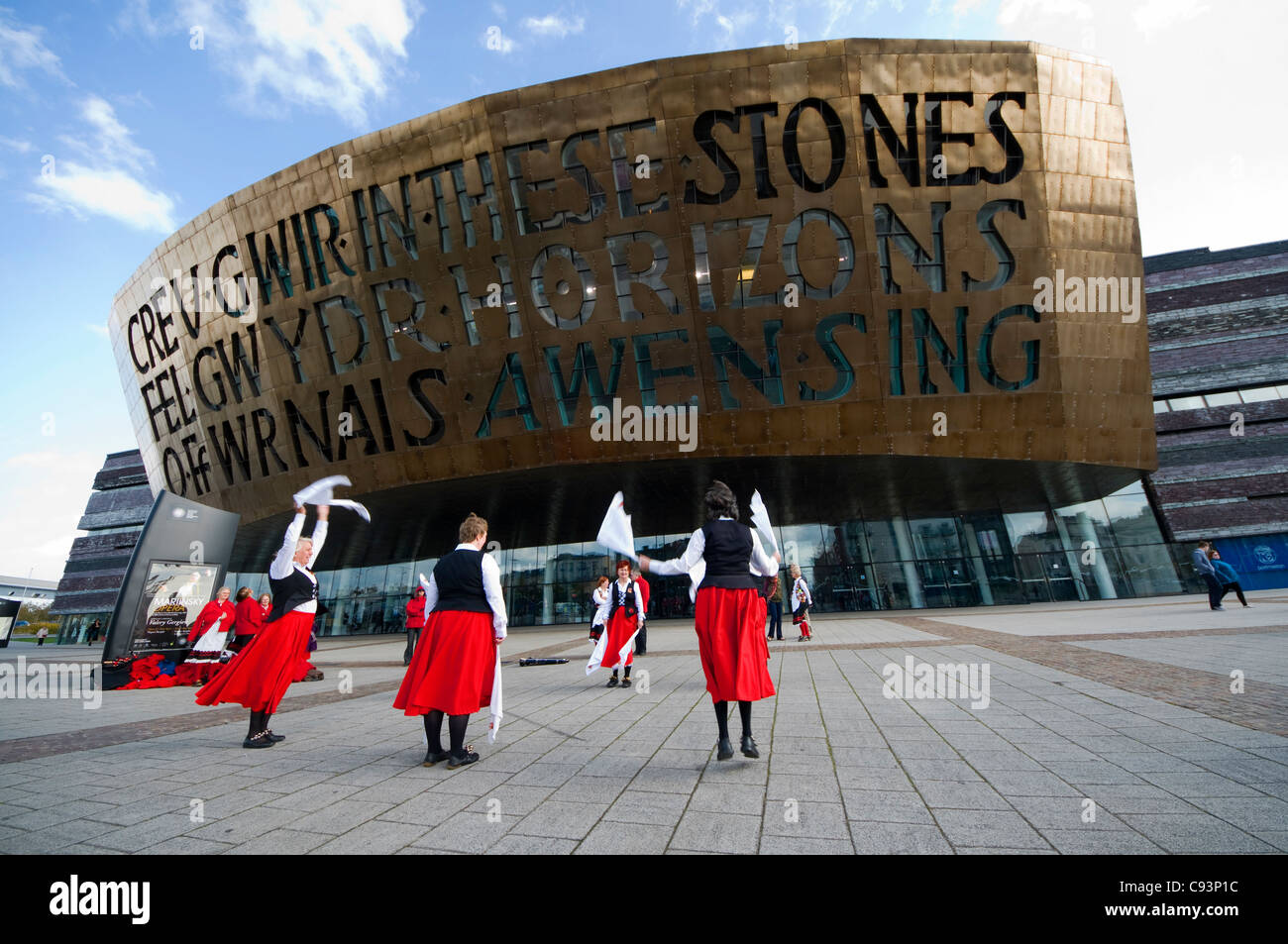 Morris dancers outside the Millennium centre, Cardiff, Wales Stock Photo