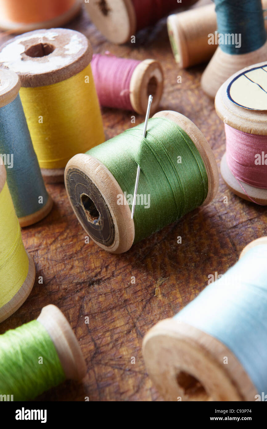 Cotton reels on table top Stock Photo