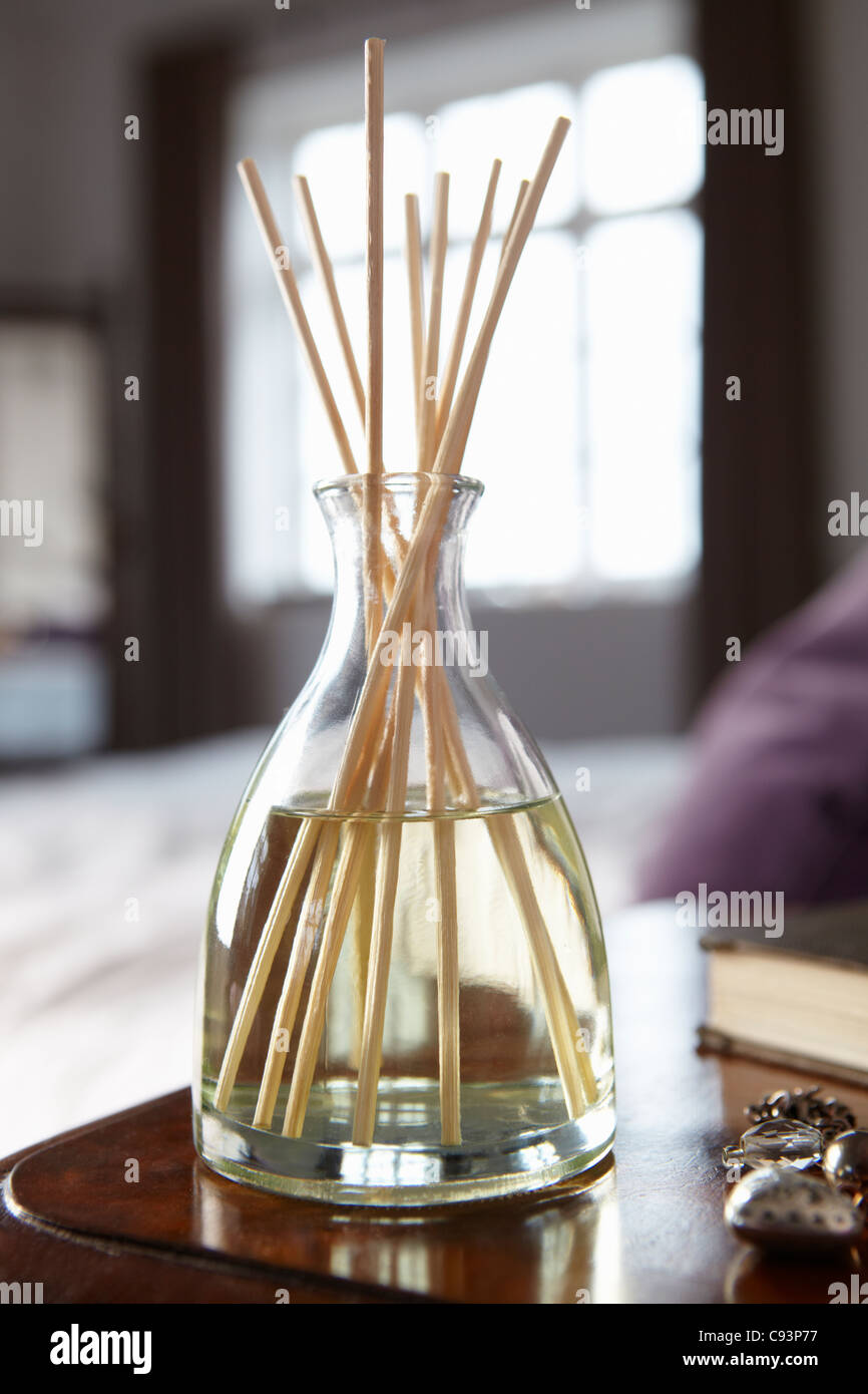 Incense sticks on bedside table Stock Photo