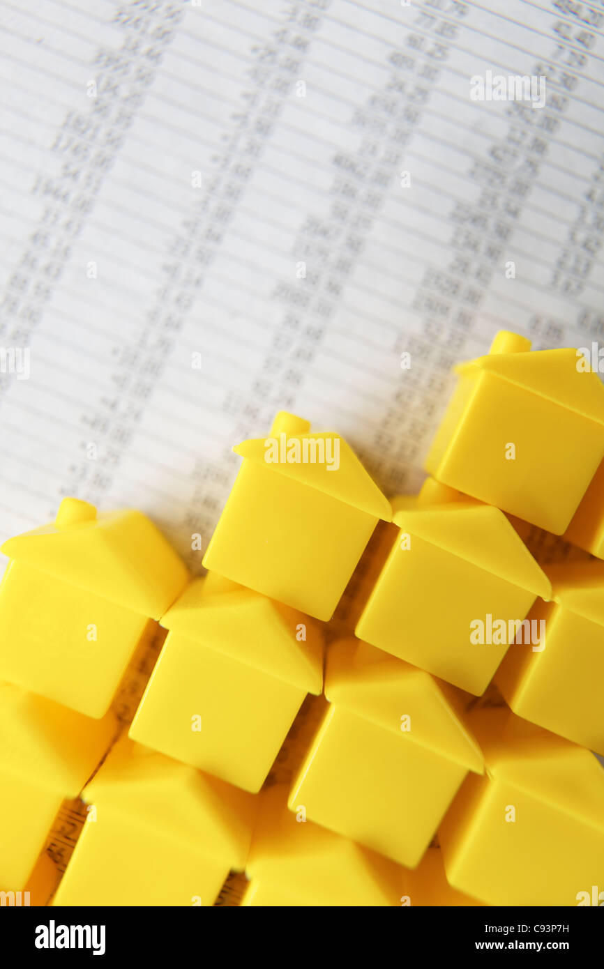 Little plastic houses on a spreadsheet Stock Photo