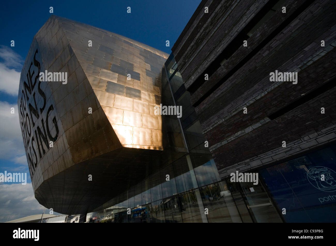 The Wales Millennium centre, Canolfan Mileniwm Cymru in Cardiff, extreme wide angle with sun reflection. Stock Photo