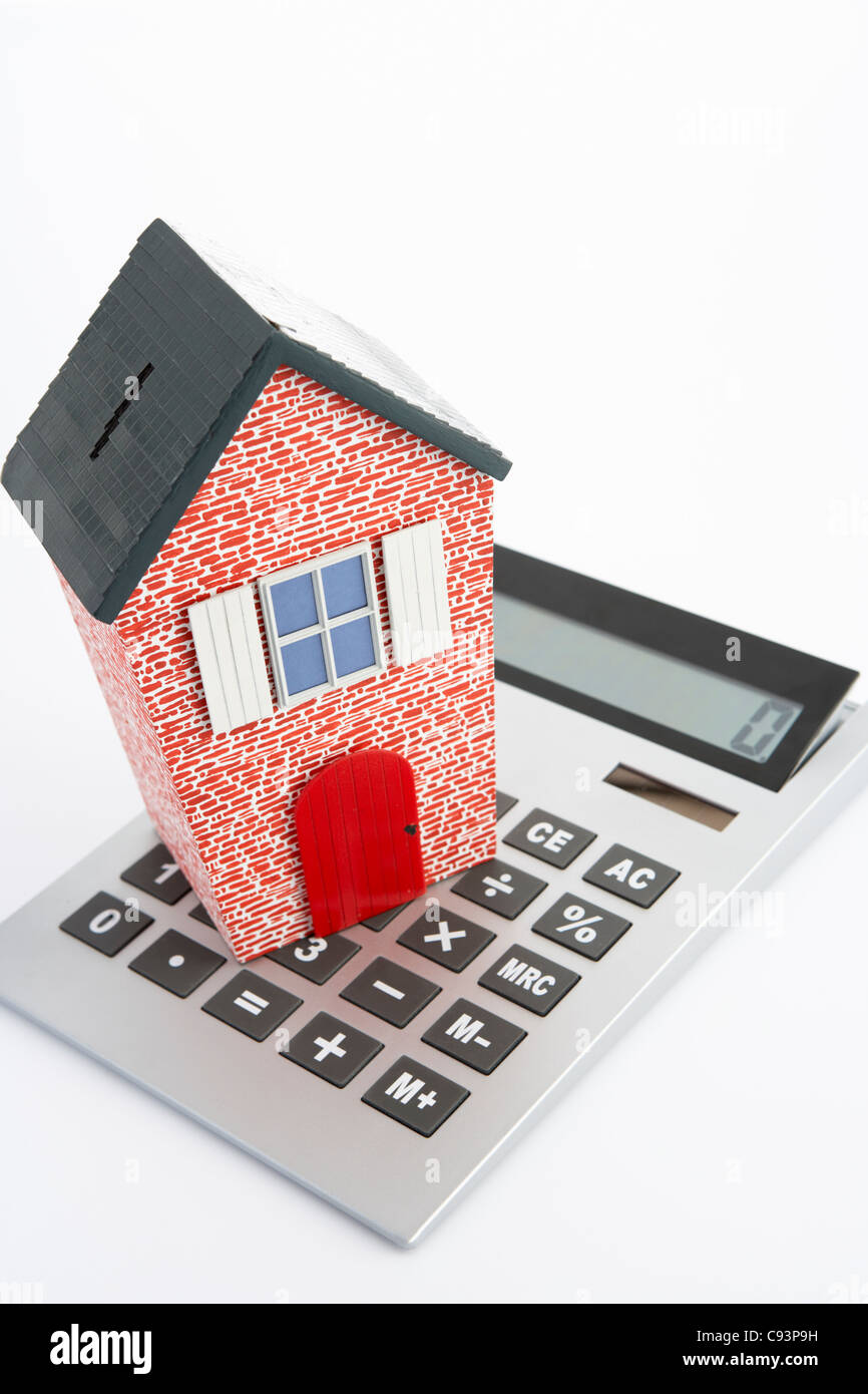 Model house and calculator Stock Photo