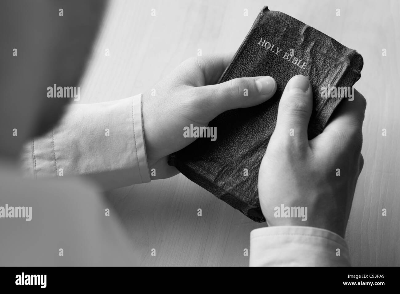 Young man holding bible Stock Photo