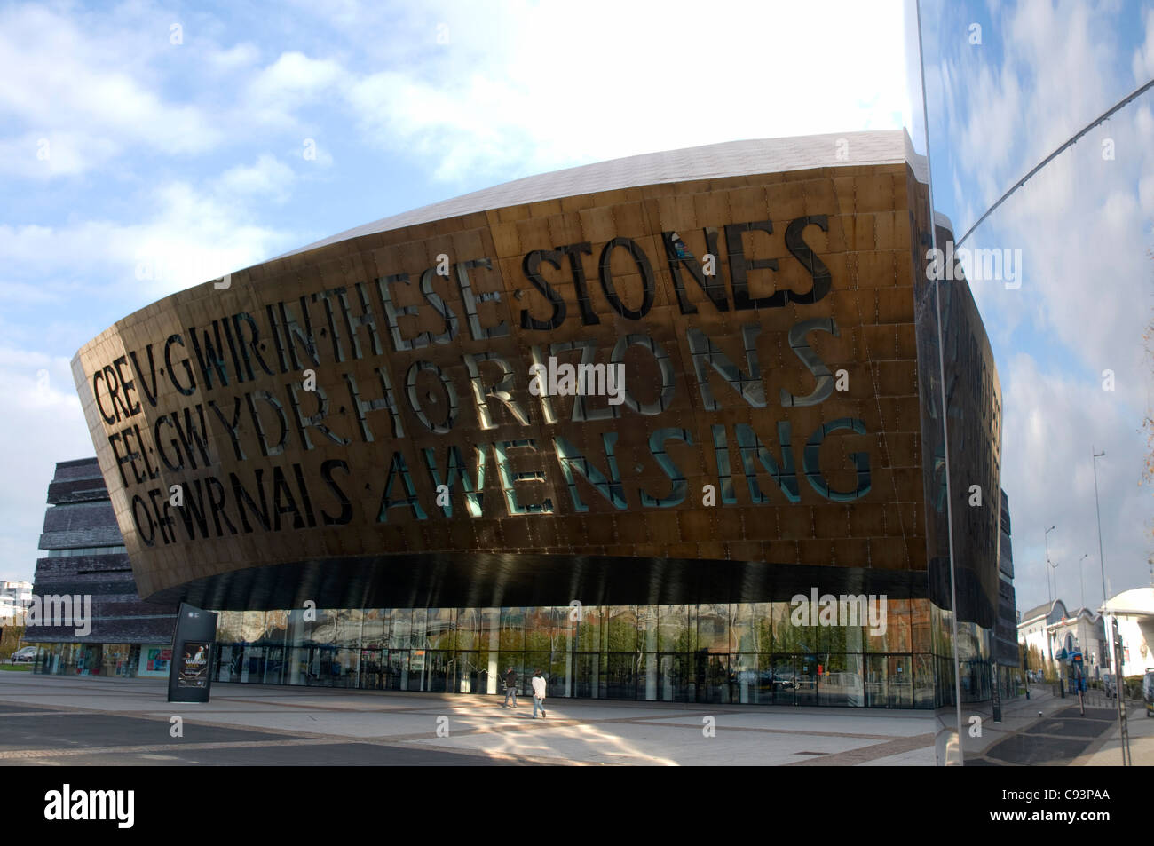 The Wales Millennium centre, Canolfan Mileniwm Cymru in Cardiff reflected in the water tower. Stock Photo
