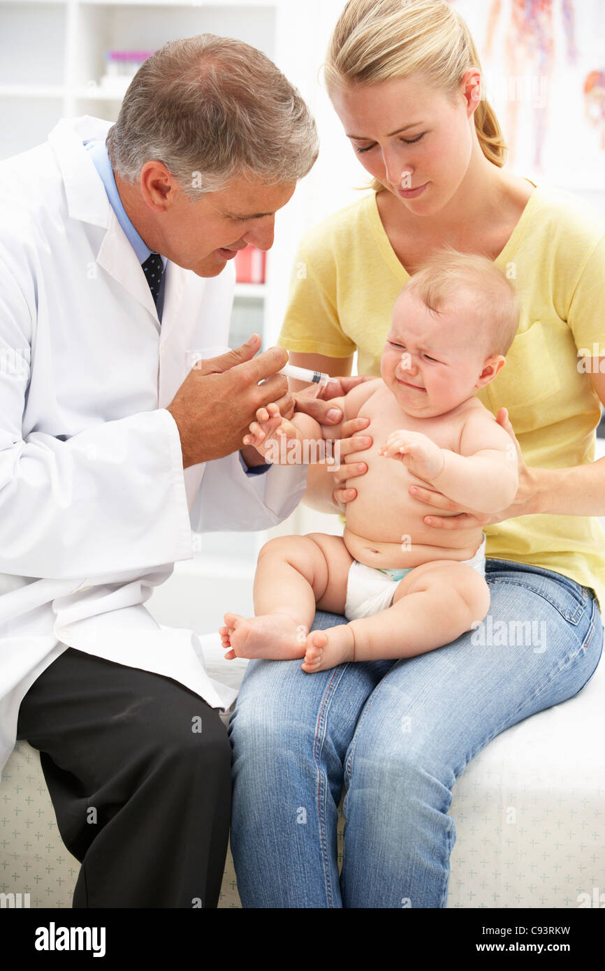 Pediatrician with baby Stock Photo