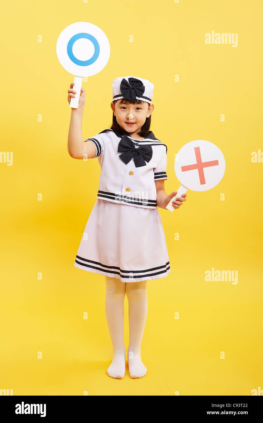 Girl holding sign board in hand studio shot Stock Photo Alamy