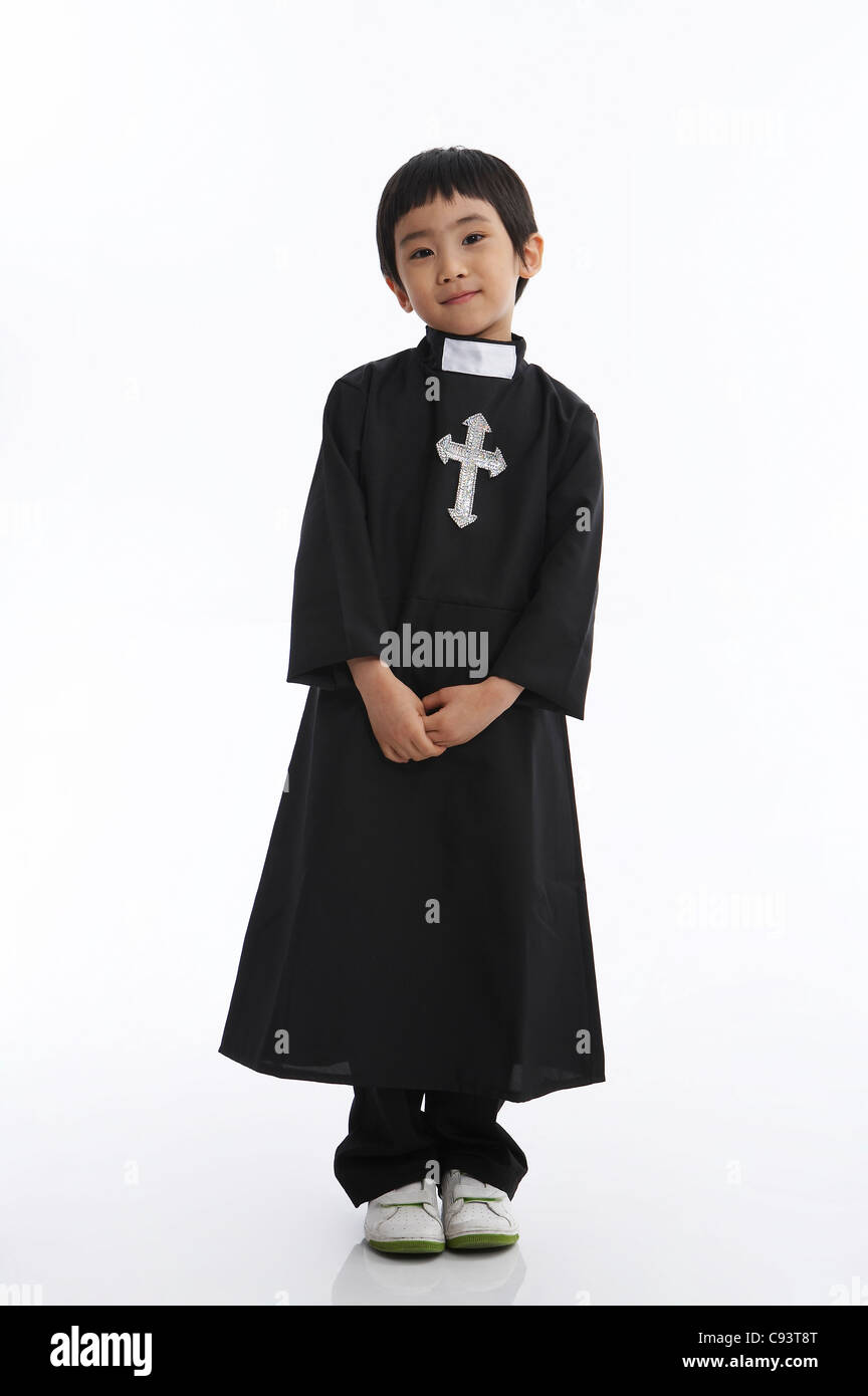 Portrait of boy in church father costume Stock Photo Alamy