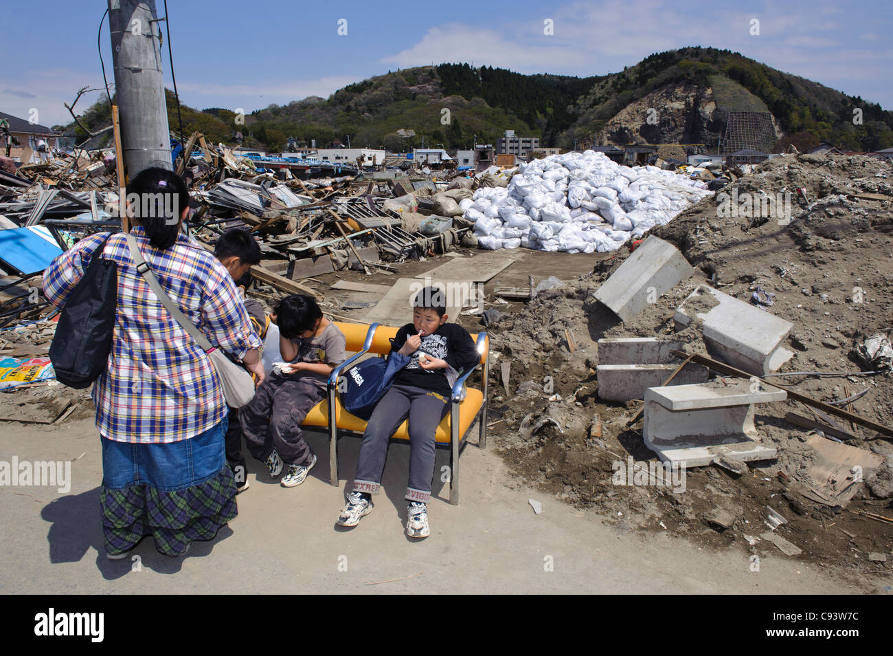 Visitors to the Ishinomaki Mangattan museum, amongst tsunami debris, Ishinomaki, Miyagi Prefecture, Japan Stock Photo