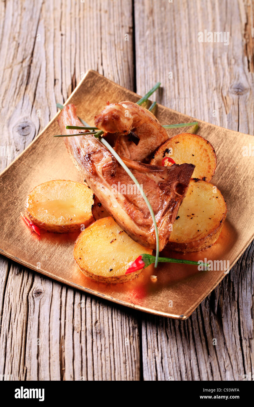 Roast lamb chops and potatoes still Stock Photo Alamy