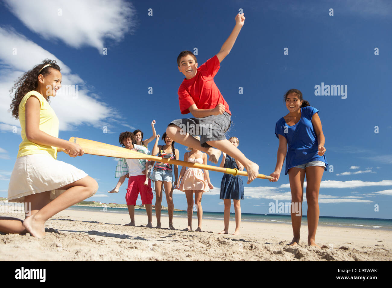 Teenagers having fun on beach Stock Photo