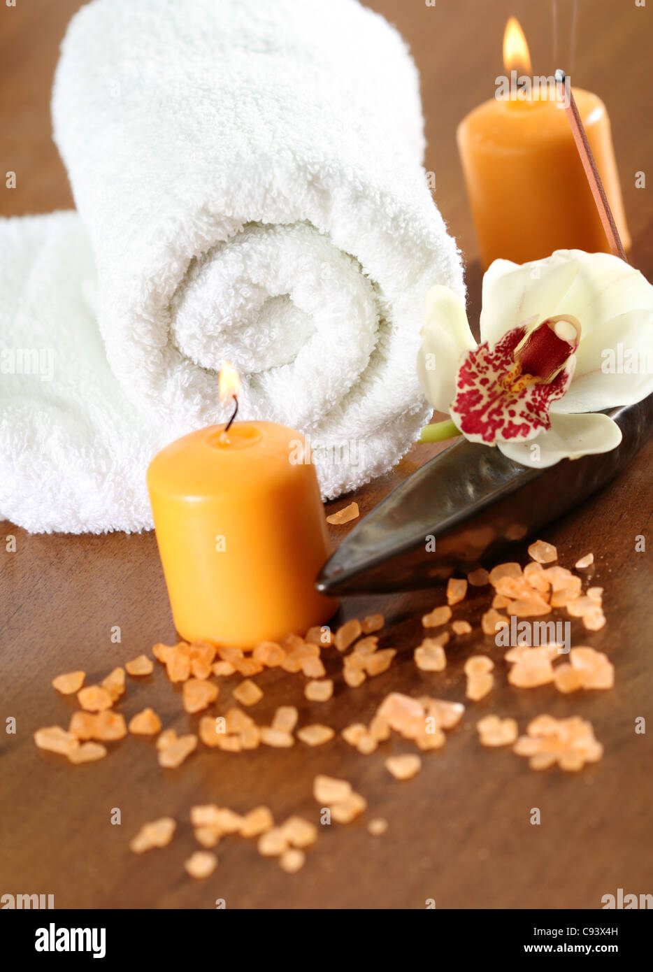 Spa setting with orchid, towel, burning candles and salt Stock Photo ...