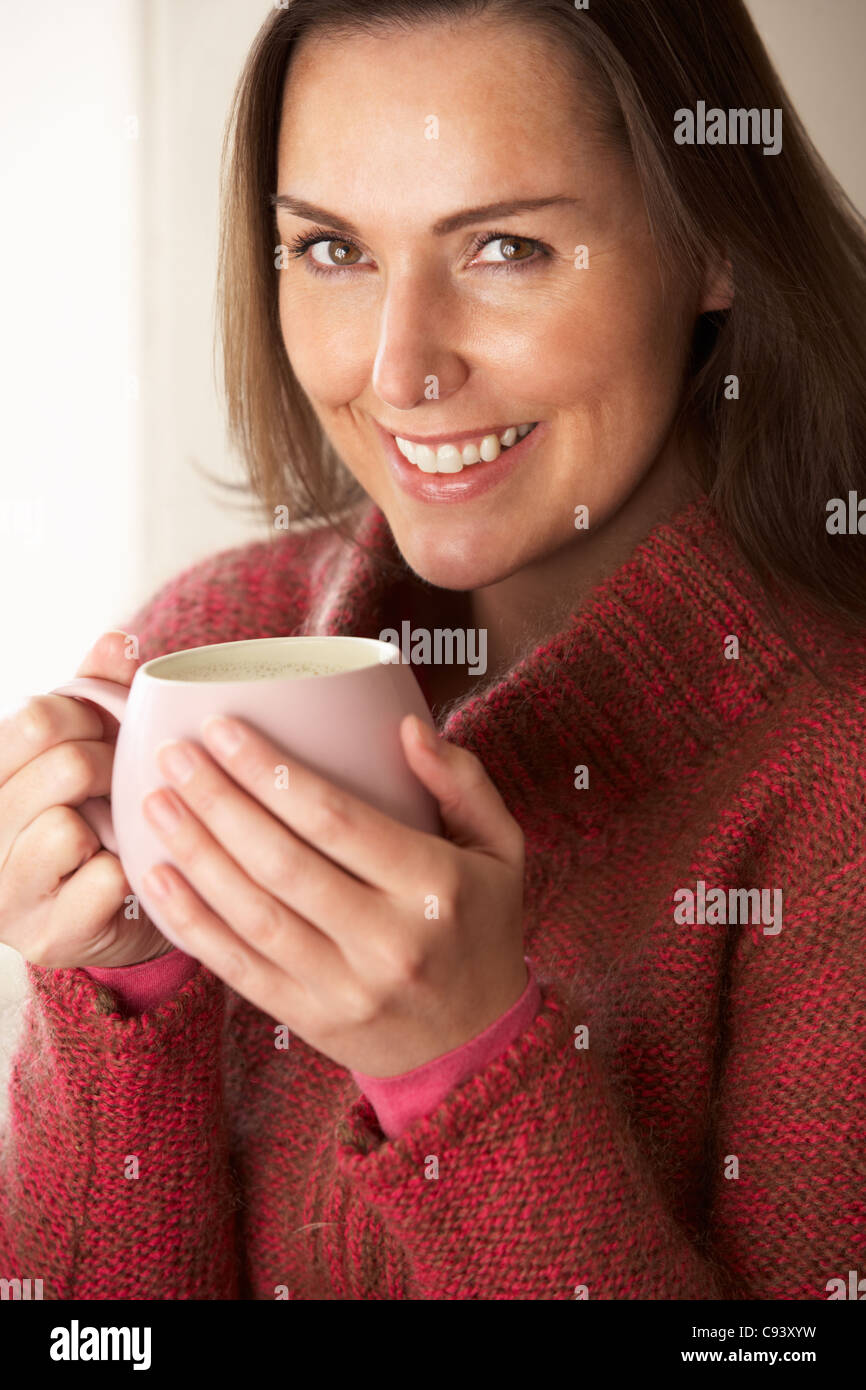 Woman with hot drink Stock Photo