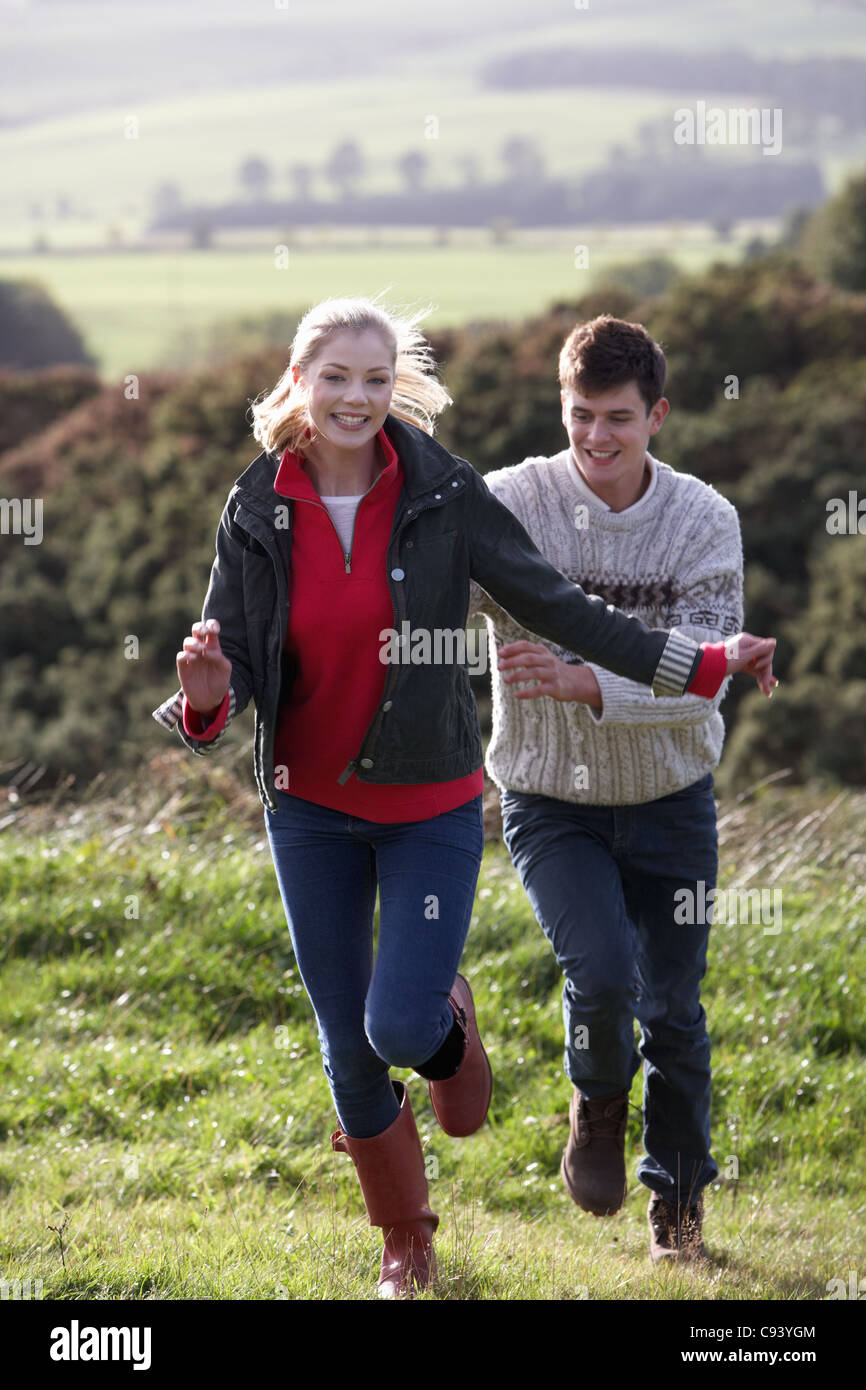 Young couple on country walk Stock Photo Alamy