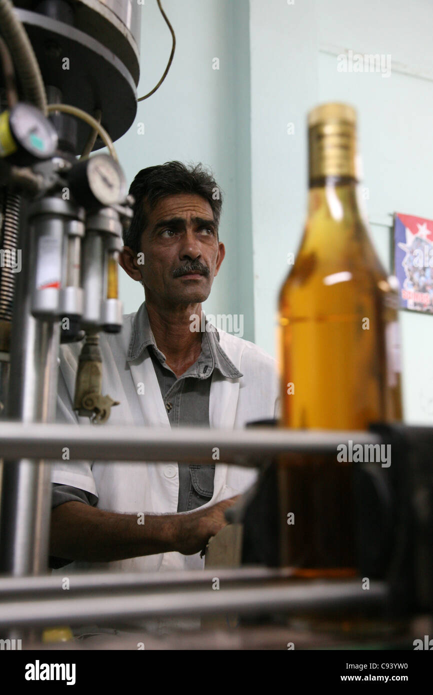 Filled bottle at the rum factory Fabrica de Bebidas Casa Garay in Pinar