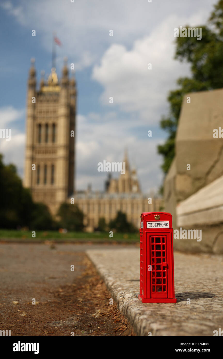 Toy telephone box in Victoria Tower Gardens, next to the Palace of Westminster. Stock Photo