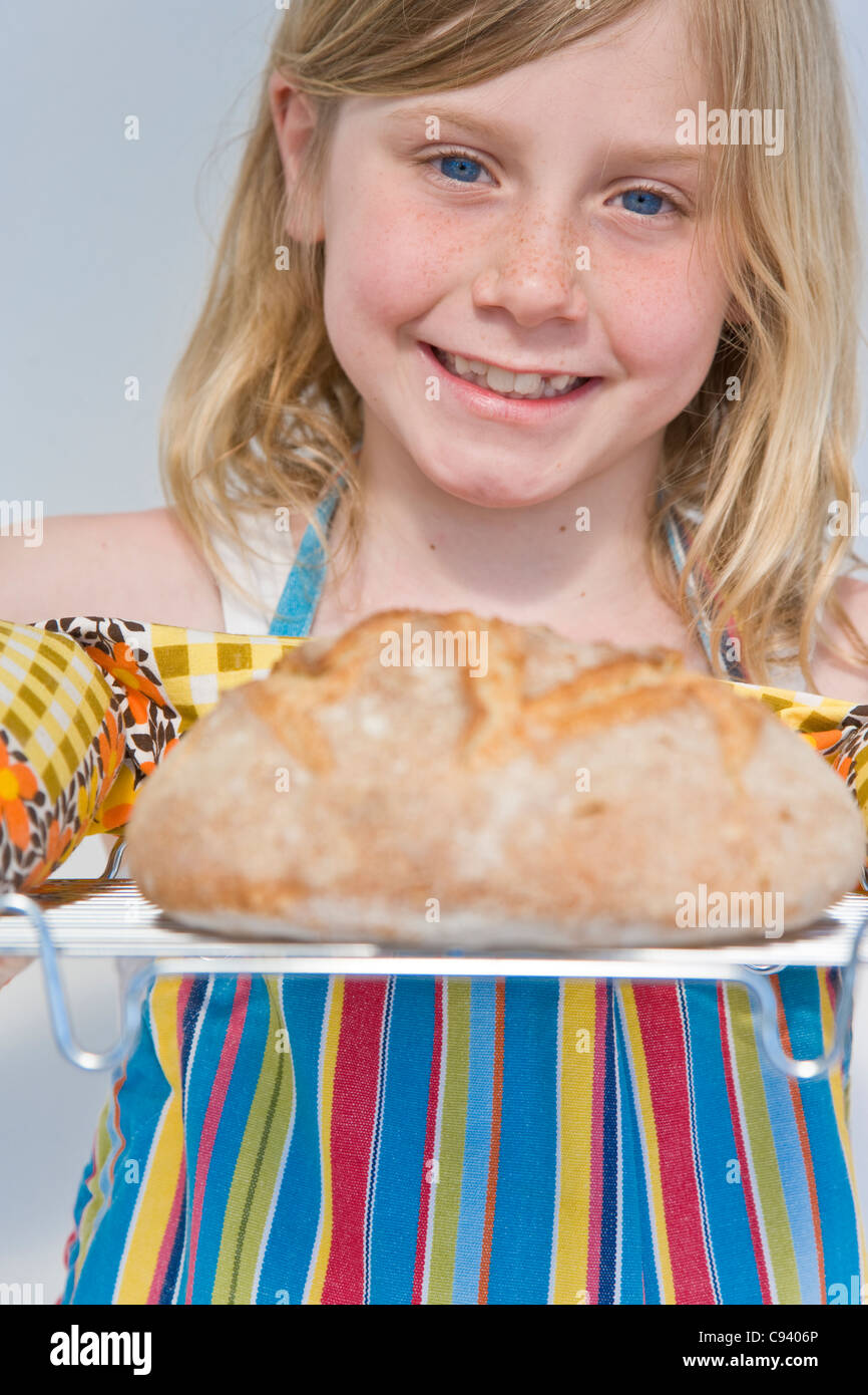 Young Girl Holding Rack with Loaf of Bread Stock Photo Alamy