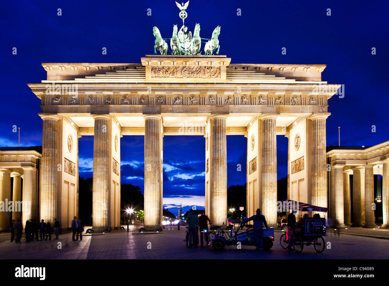 The iconic landmark of the Brandenburger Tor floodlit at twilight in Berlin, Germany, Europe, EU Stock Photo