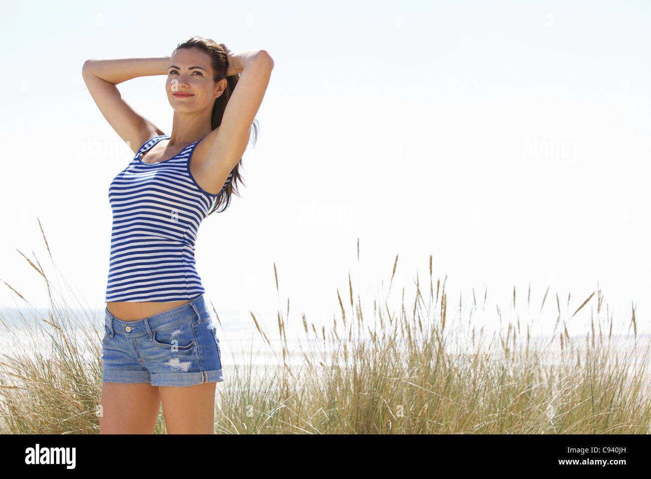 Crossed Arms Behind The Head High Resolution Stock Photography and