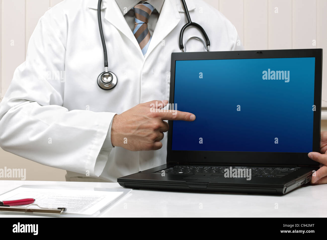 Doctor with blank laptop screen Stock Photo