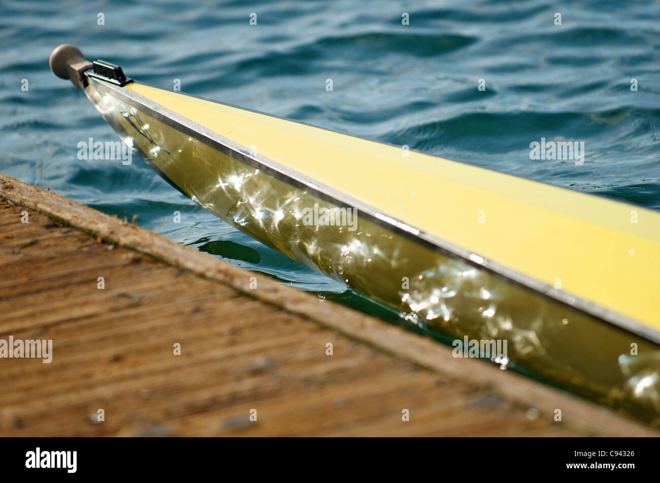 Detail of a scull rowboat and a dock. Stock Photo