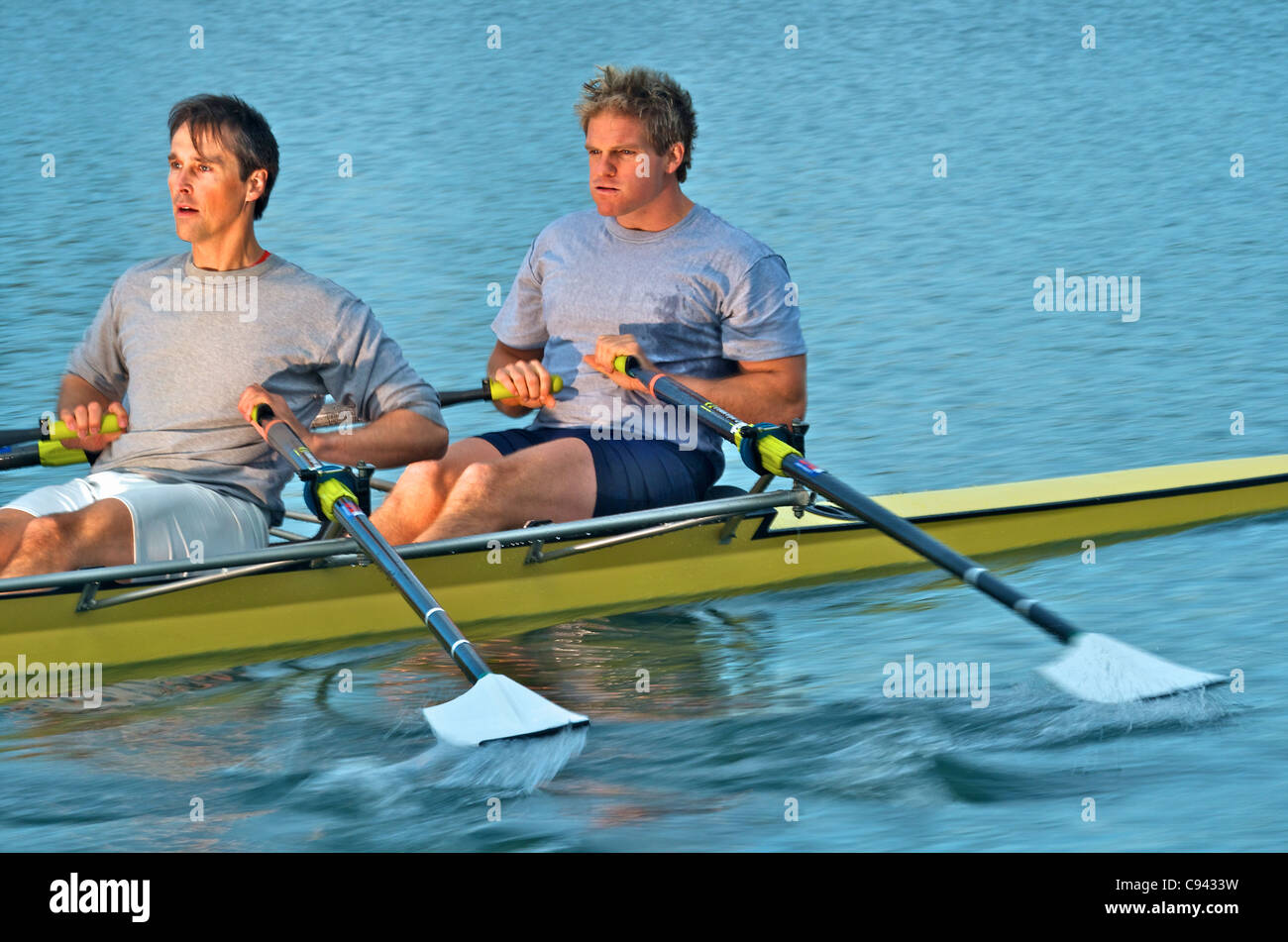 Rowers rowing in a double scull rowboat Stock Photo Alamy