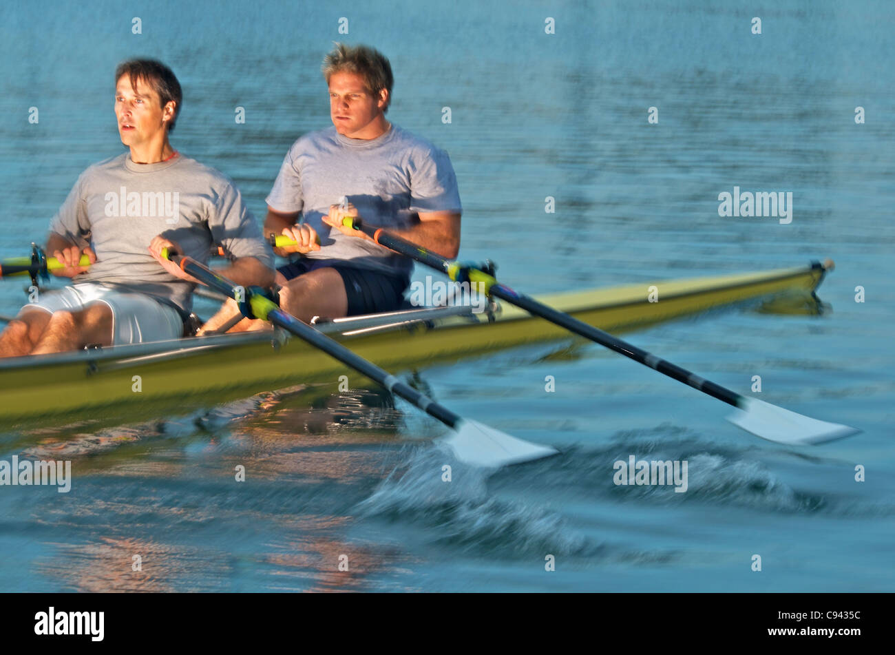 Rowers rowing in a double scull rowboat Stock Photo Alamy