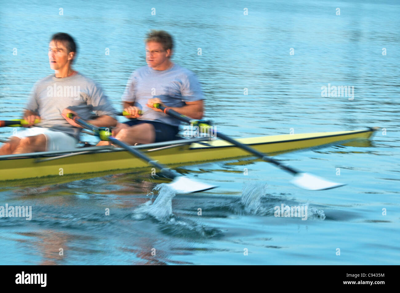 Rowers rowing in a double scull rowboat Stock Photo Alamy