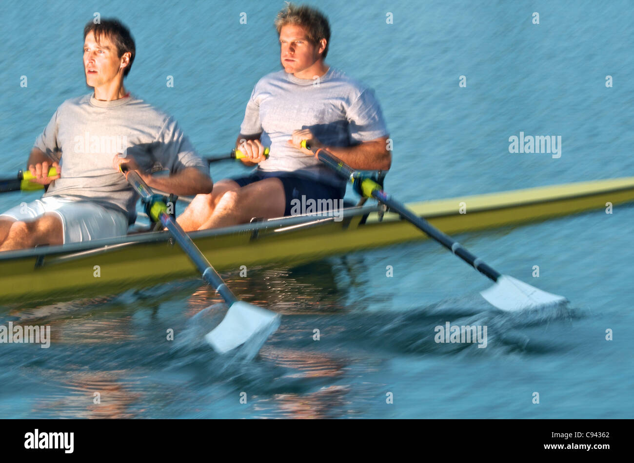 Rowers rowing in a double scull rowboat Stock Photo Alamy