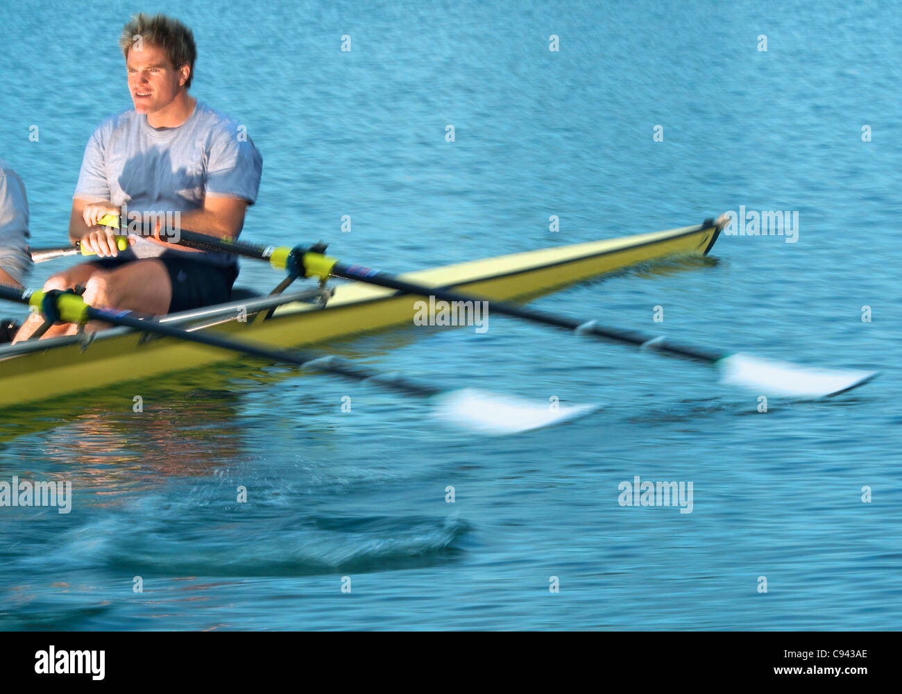 Rowers rowing in a double scull rowboat. Stock Photo