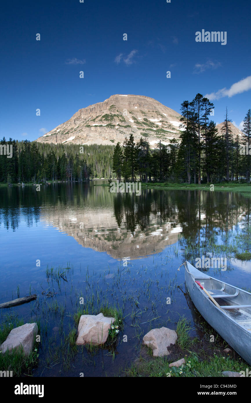 Mirror Lake with canoe Wasatch National Forest Utah in Summer Stock Photo
