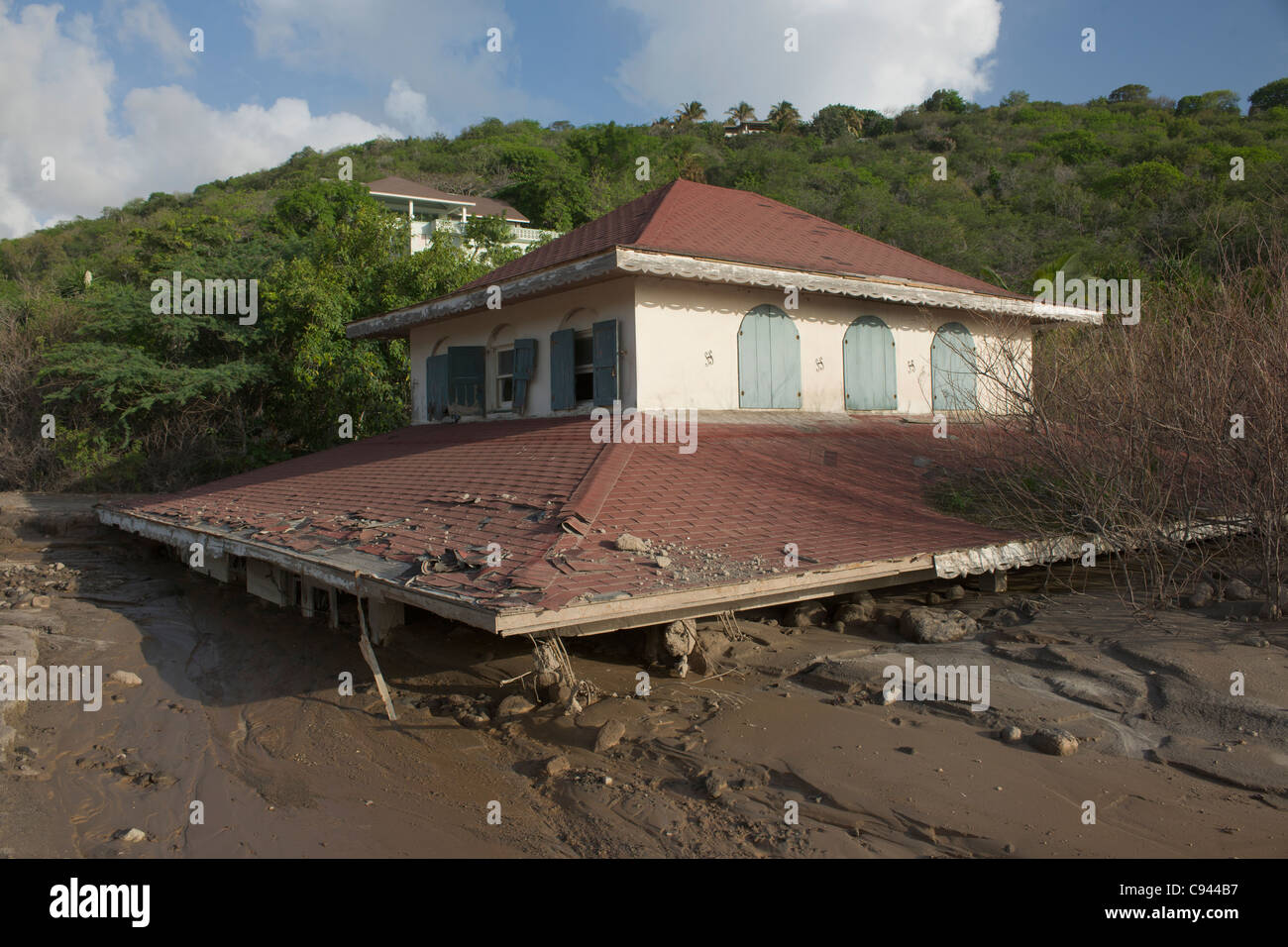 Roof of the three storey Crowe House buried by mud flows, called lahars, down the Belham River, Montserrat Stock Photo