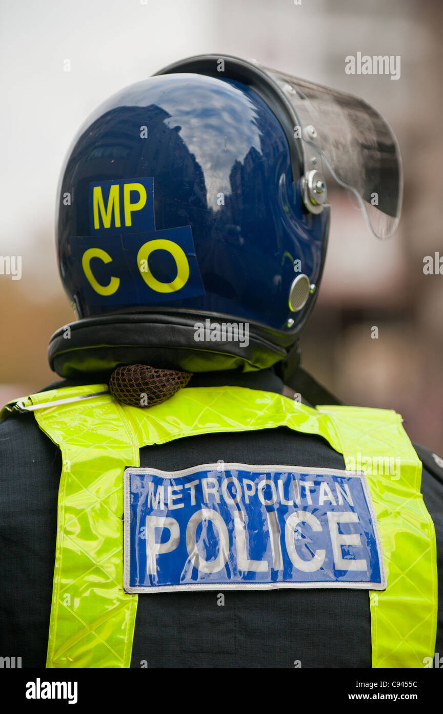 A Metropolitan Police Officer in a riot helmet Stock Photo