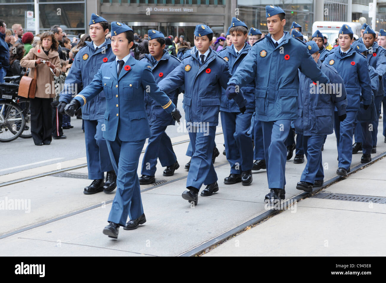 Royal Canadian Air Cadet Paiva leads squad mates marching along Queen Street West in front of Old City Hall during the Remembrance Day ceremony in Toronto, Ontario, Canada, November 11, 2011. Stock Photo