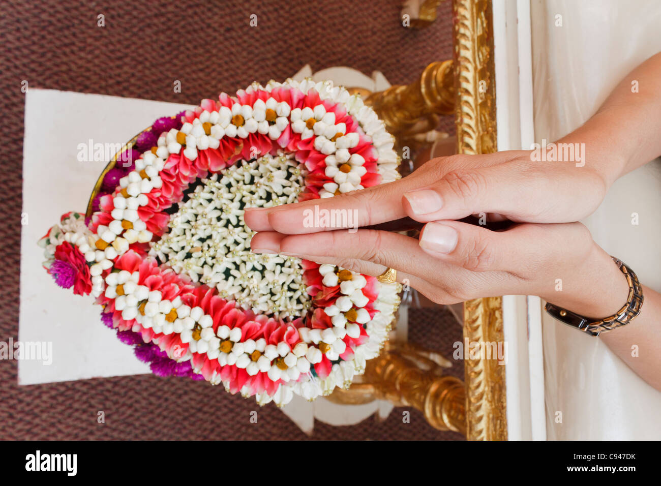 Hand of bride wait for blessed water at Thai wedding ceremony in Thailand Stock Photo