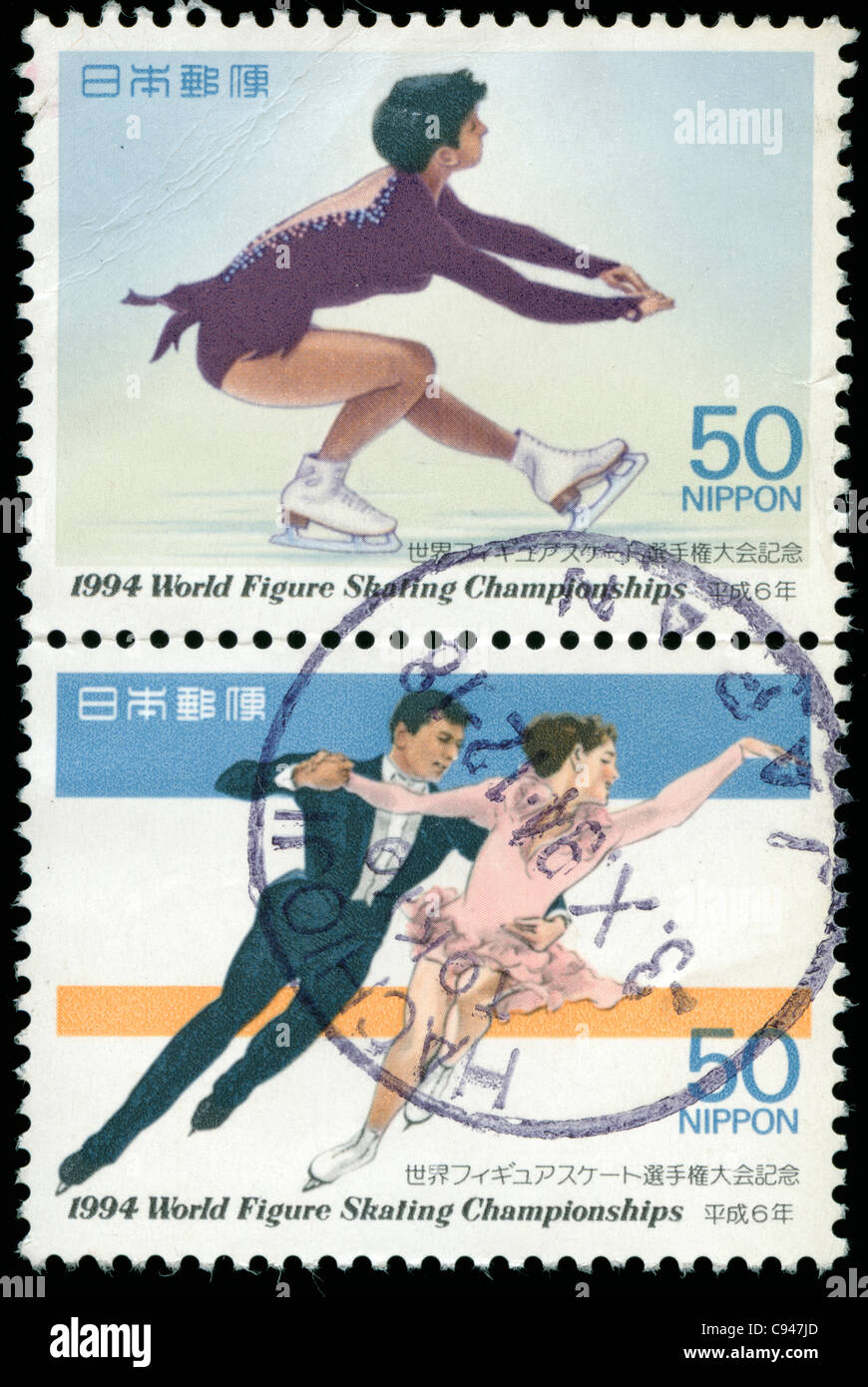 Two old stamps from Japan with pictures of ice skaters Stock Photo