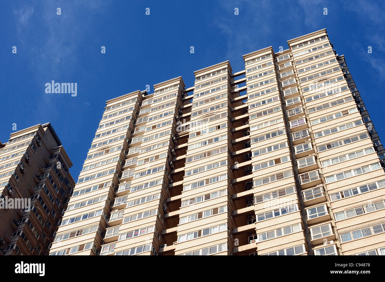 Apartment buildings against blue sky Stock Photo - Alamy