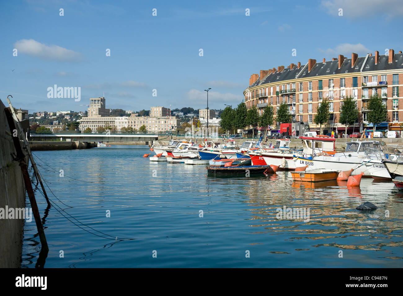 Fishing boats and motor yachts in the bassin du roi, oldest harbour of Le Havre, UNESCO world heritage city in Normandy, France Stock Photo