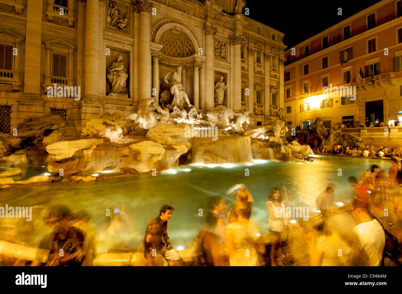 Trevi Fountain, Rome, Italy - tourists at night Stock Photo
