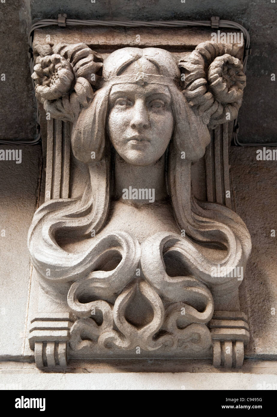 Female head stone carving, Barcelona, Spain Stock Photo