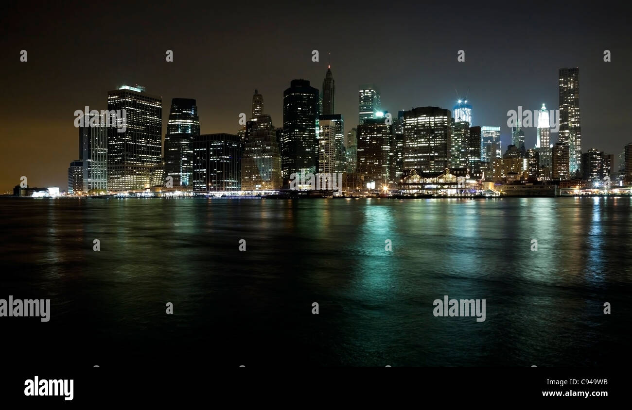 The New York City skyline at twilight w the Freedom tower Stock Photo ...