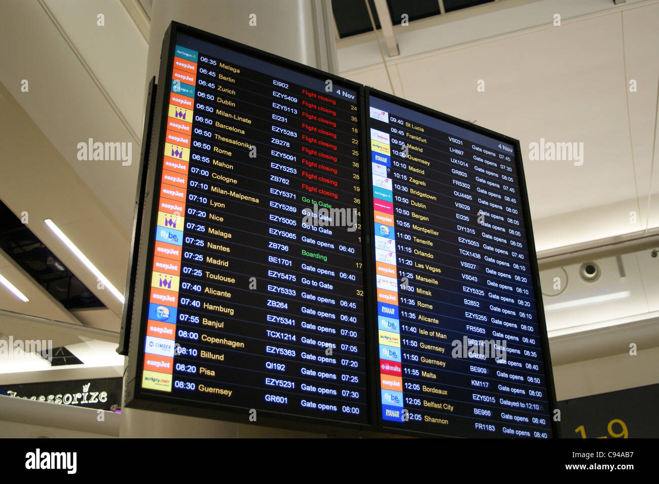 Airport departure board sign at Gatwick Airport, London, England Stock Photo