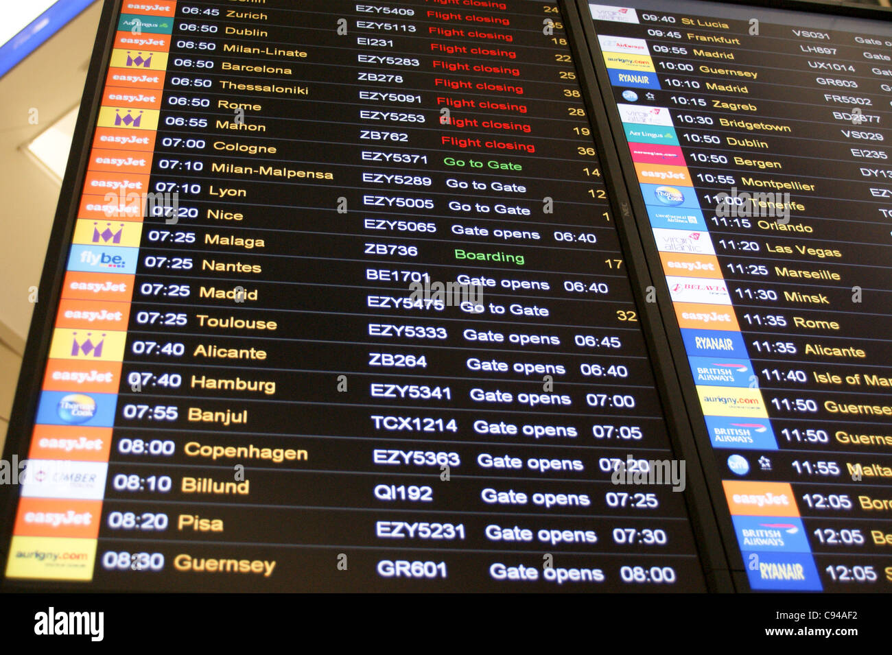 Airport departure board sign at Gatwick Airport, London, England Stock Photo