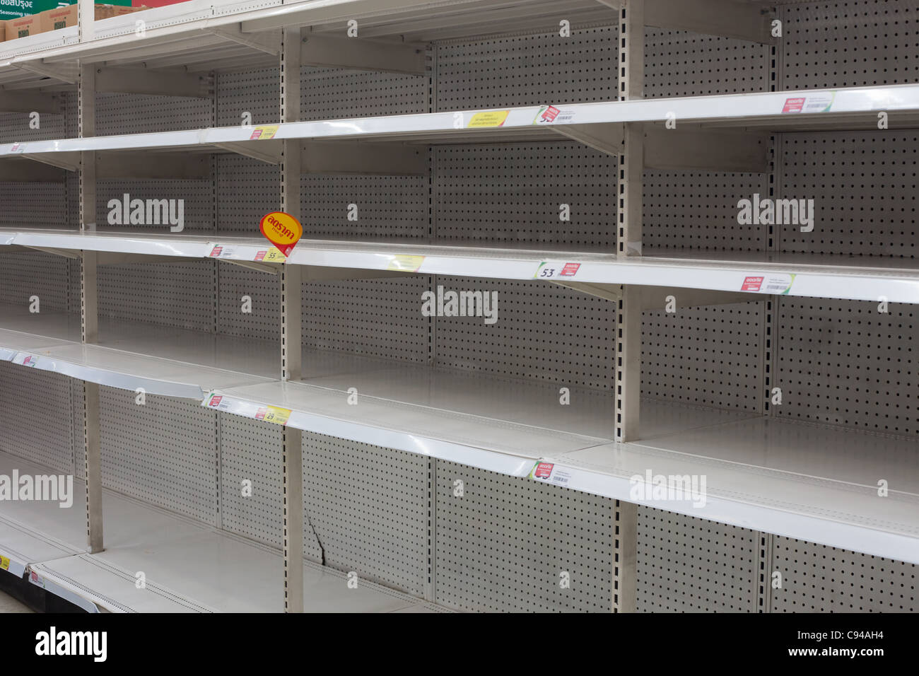 Bangkok, Thailand - October 21, 2011: Emptied instant noodle shelves at a supermarket during the floods in Bangkok Stock Photo