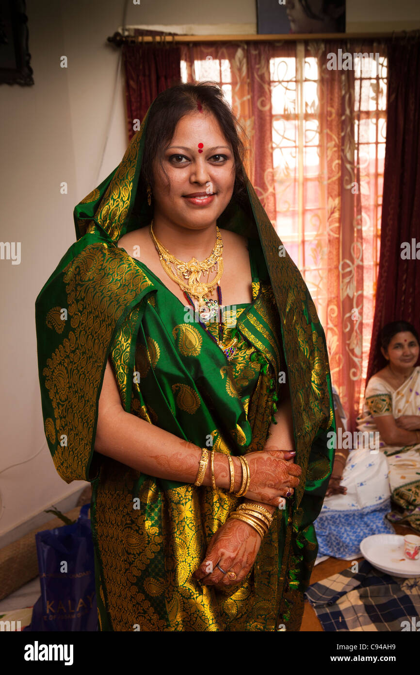India, Assam, Guwahati, weddings, upper class Assamese bride, at home, during ceremony to meet bridegroom’s family Stock Photo