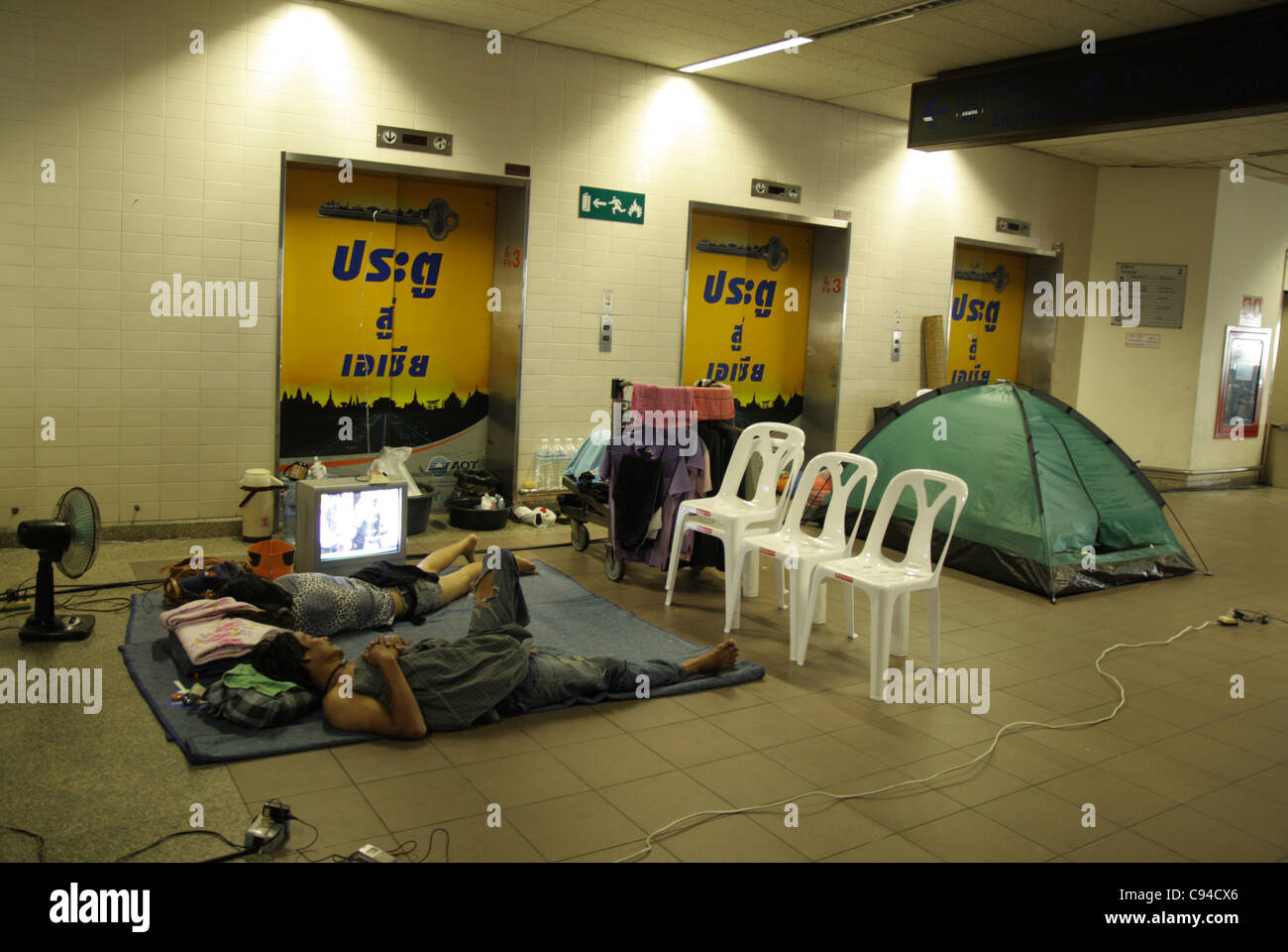 People Sleeping In A Flooding Shelter At Don Muang Domestic