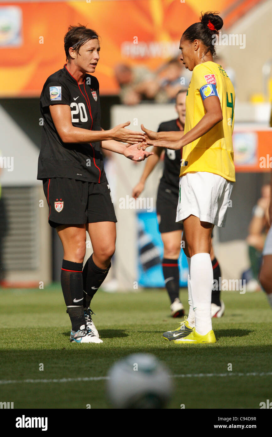 Abby Wambach of the USA (L) and Aline of Brazil (R) talk and shake hands after a contentious play - World Cup 2011 quarterfinal. Stock Photo